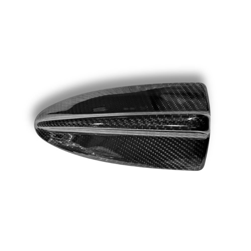 Carbon fiber roof antenna cover for BMW E46, E90, E91, E92, E93 by Palenon Performance, shown on vehicle rooftop.