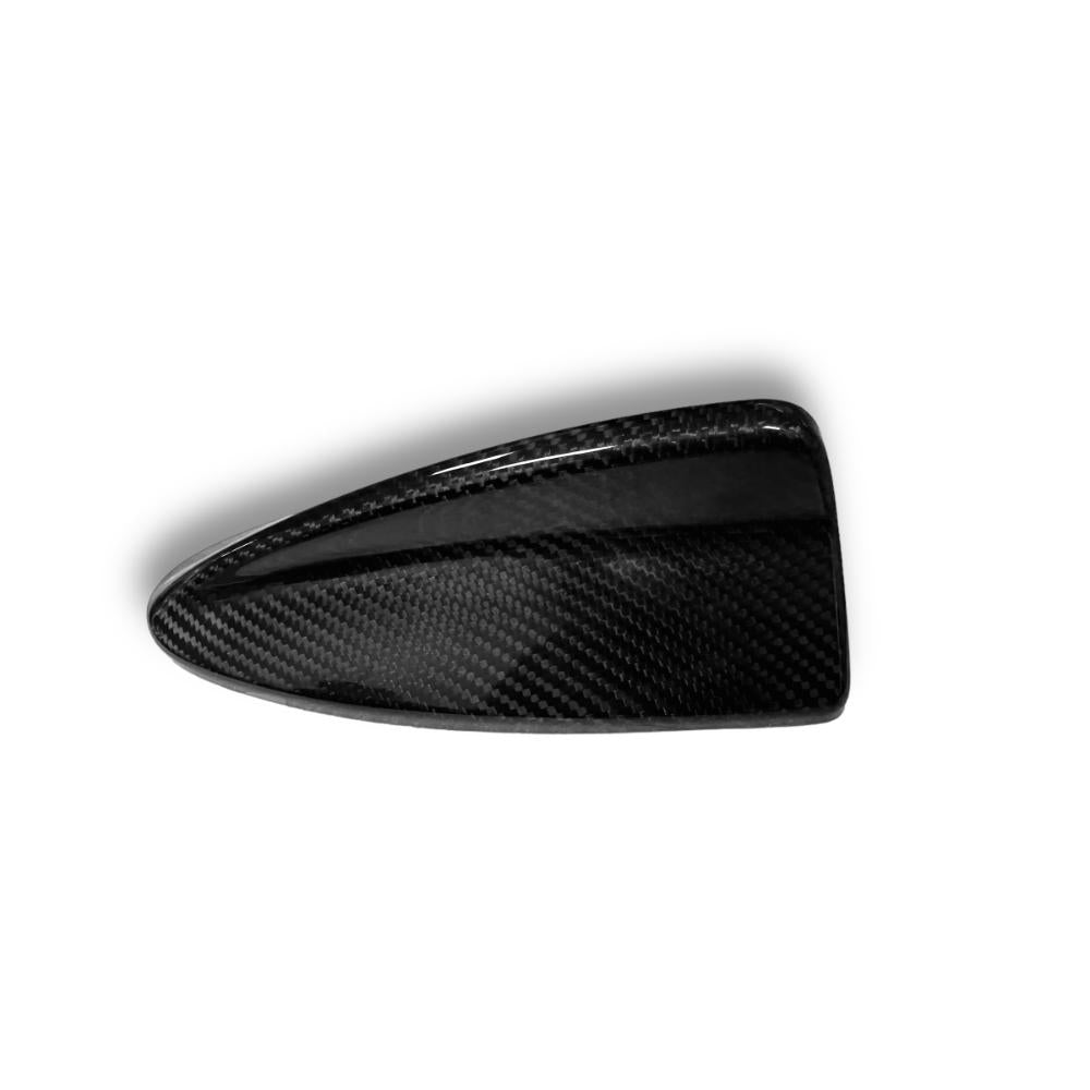 Carbon fiber roof antenna cover for BMW E46, E90, E91, E92, E93 models by Palenon Performance, shown on vehicle roof.
