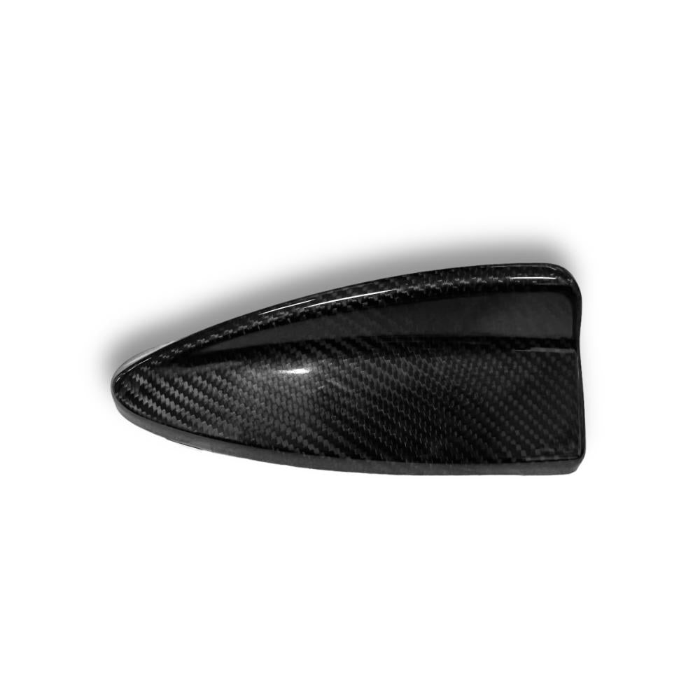Carbon fiber roof antenna cover for BMW E46, E90, E91, E92, E93 from Palenon Performance, shown on vehicle roof.