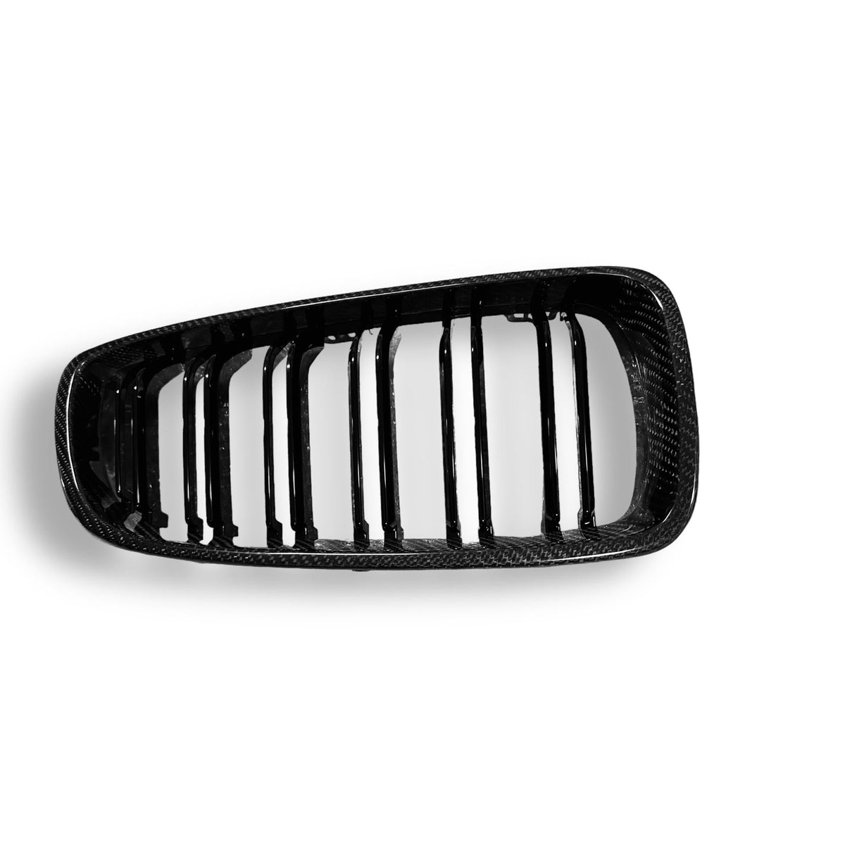 Carbon fiber grille for BMW F80 M3, F82 M4, F32, and F33 by Palenon Performance, showing sleek, textured carbon fiber design.