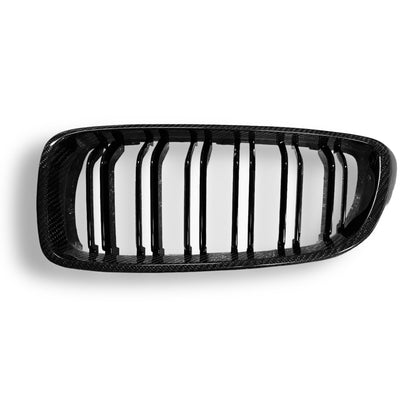 Carbon fiber grille for BMW F80 M3, F82 M4, F32, and F33 models by Palenon Performance, showing the sleek textured design.