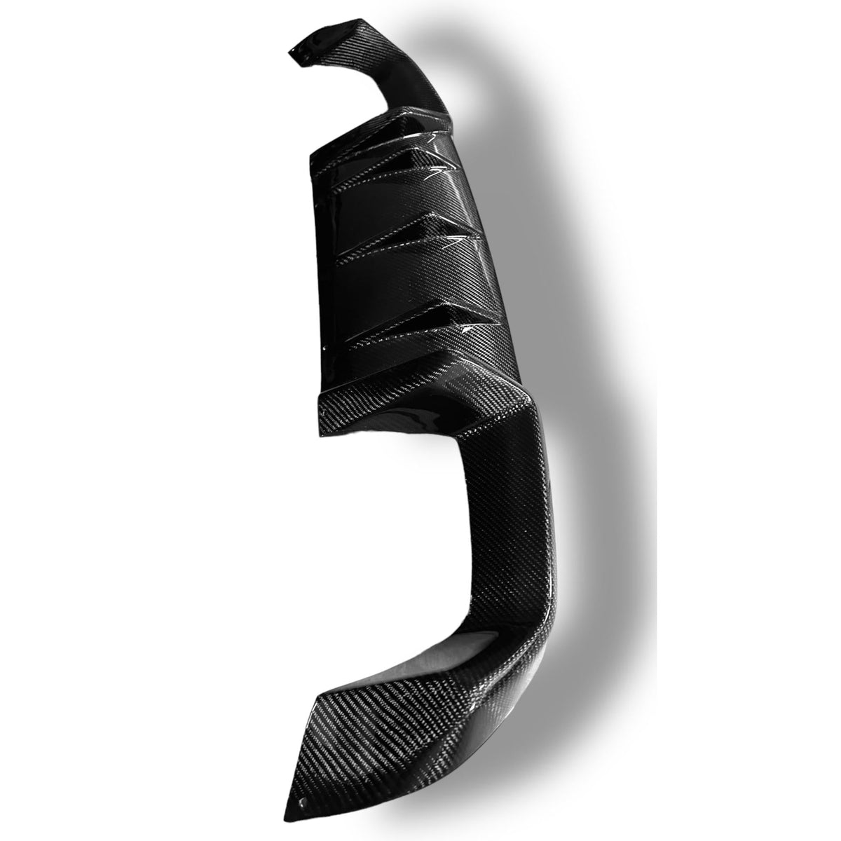 BMW F87 M2 carbon fiber rear diffuser by Palenon Performance, showcasing sleek, aerodynamic design and high-quality carbon fiber material.