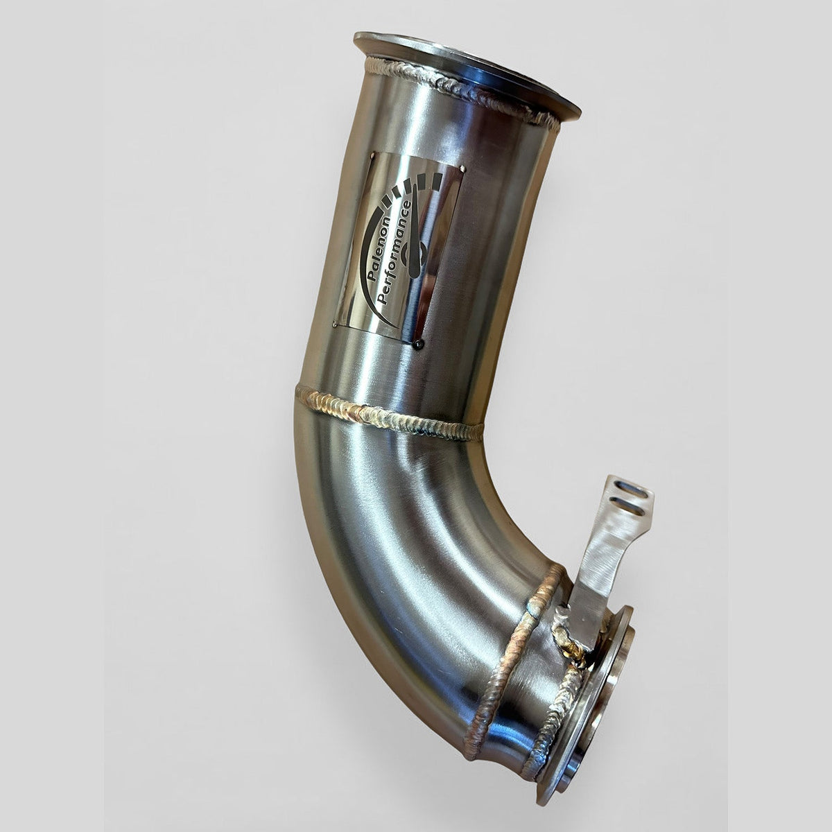 BMW F90 M5 racing downpipe by Palenon Performance, showcasing the high-performance exhaust component with polished metal finish.