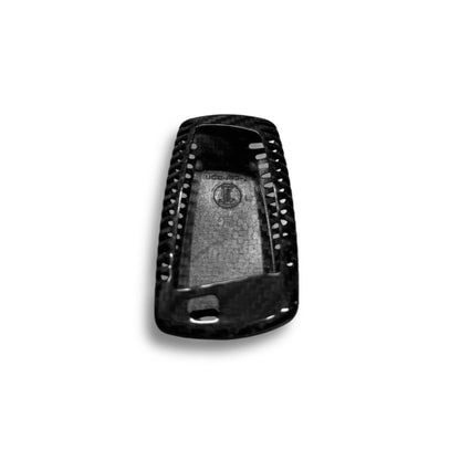 BMW X5, X6, X1 carbon fiber key cover by Palenon Performance, showcasing sleek black carbon fiber material on a car key.