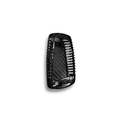 BMW X5, X6, X1 carbon fiber key cover by Palenon Performance, close-up view showing sleek black textured finish.