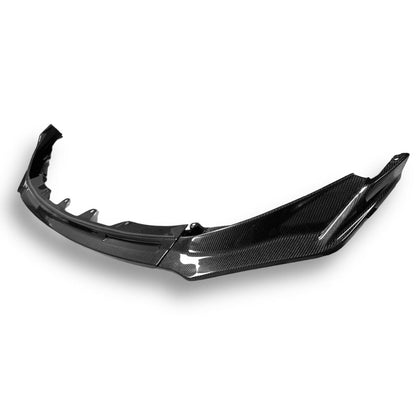 Carbon fiber V Style front lip for BMW G80 M3, G82 M4, G83 M4, by Palenon Performance, shown on a sleek BMW model.