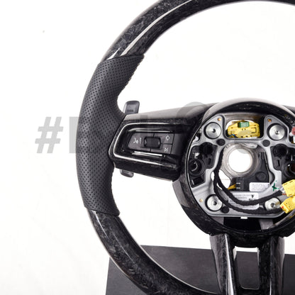 Custom carbon fiber steering wheel for Porsche 911 (992), Taycan, or Macan by Exclusive Steering, showing detailed craftsmanship and design.