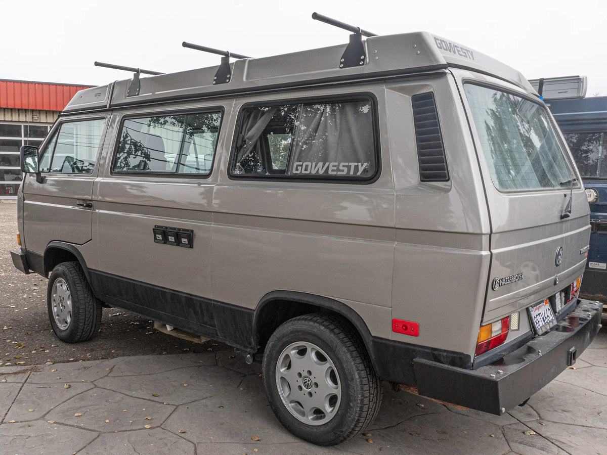 GoWesty bolt-on roof rack bundle installed on Vanagon Westfalia, showing durable roof racks with mounting hardware.