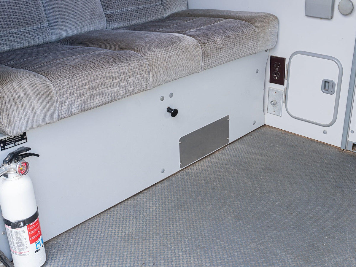 GoWesty rear heater vent block-off plate installed inside a Vanagon interior, covering the rear heater vent opening.