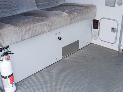 GoWesty rear heater vent block-off plate installed inside a Vanagon interior, covering the rear heater vent opening.