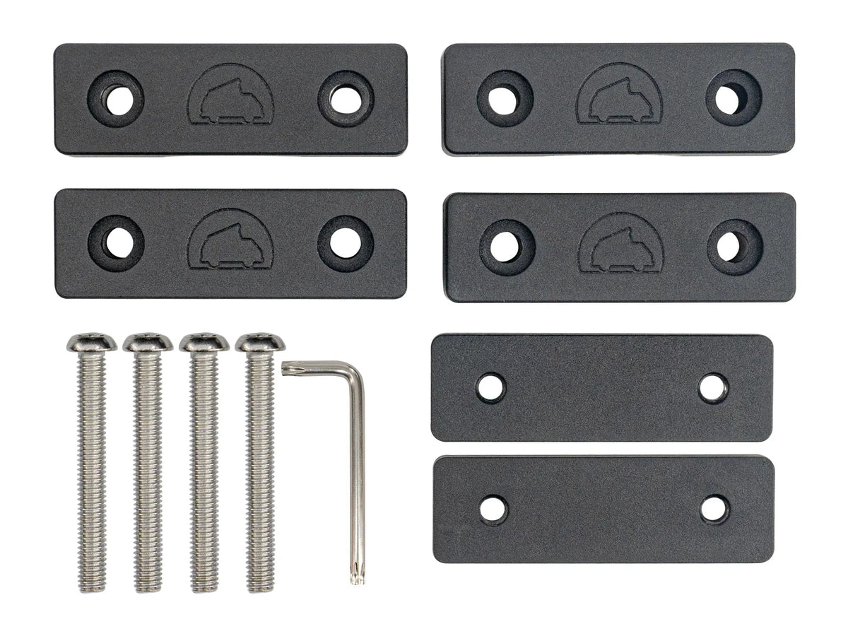 Pair of GoWesty Billet Crossbar Mounts for Vanagon Westfalia roof racks, laid out with mounting hardware and brackets visible.