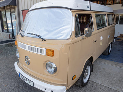 GoWesty Snow & Sun Shade for bus window cover, installed on vehicle window, provides sun protection and privacy.