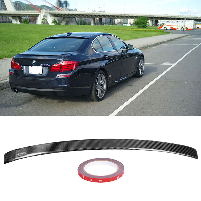 BMW 5-Series F10 4-door A Style roof spoiler by K2 Industries, made of carbon fiber, installed on the vehicle's rear roof.