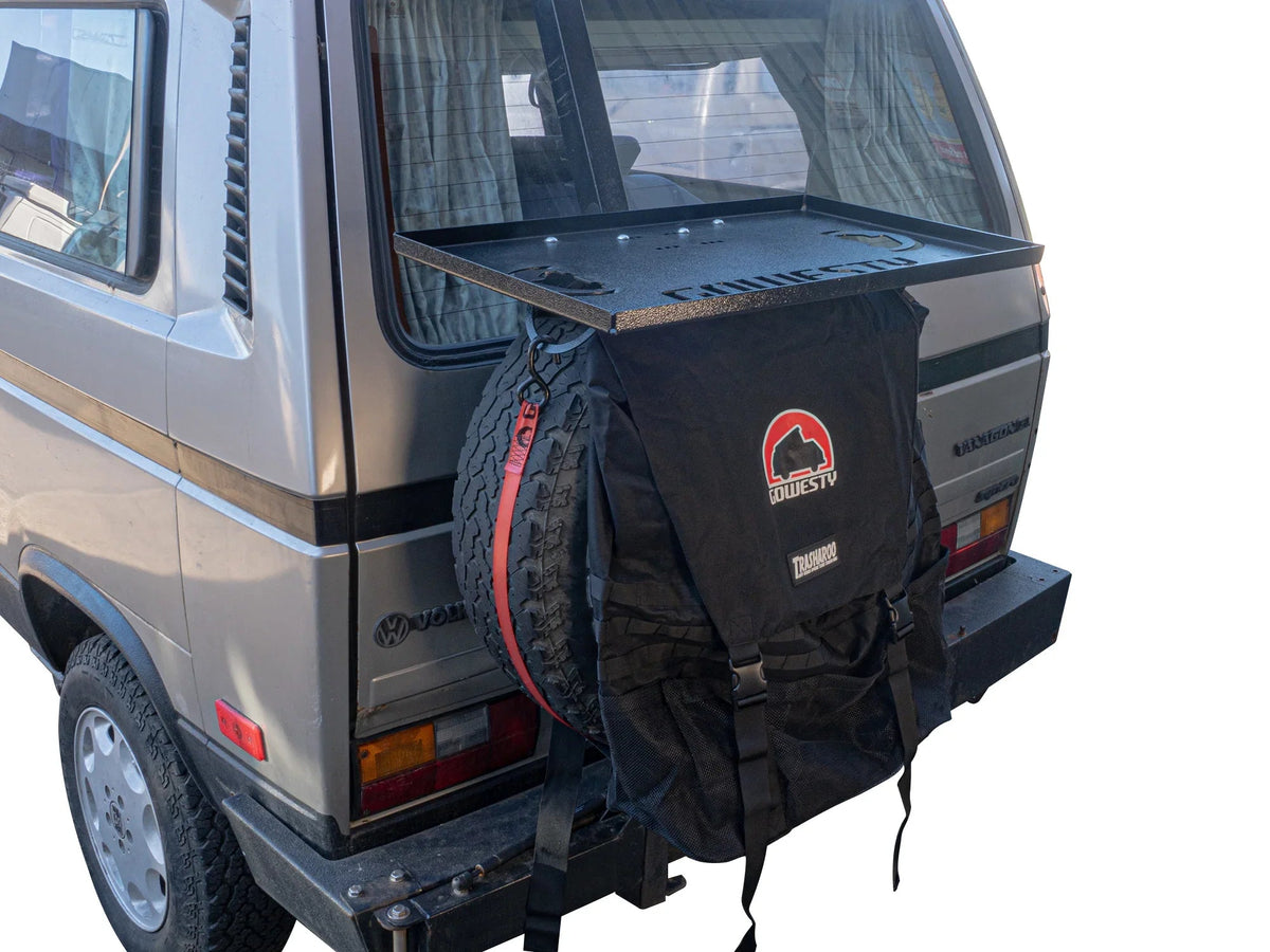 GoWesty tray on spare bracket for Bus/Vanagon, mounted on rear exterior with Trasharoo in place for outdoor storage.