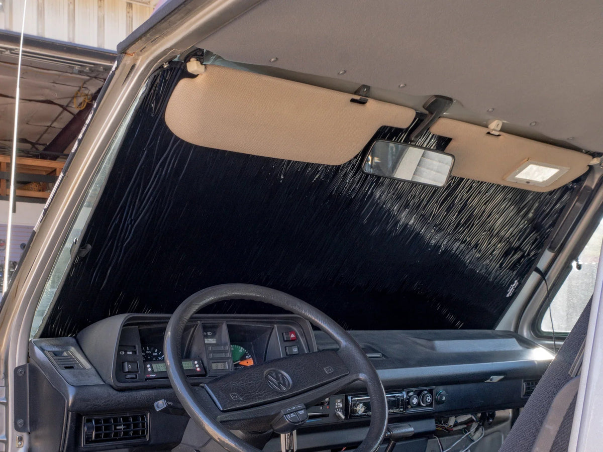 GoWesty Vanagon window cover insulation and privacy shade installed on van window, providing insulation and privacy.