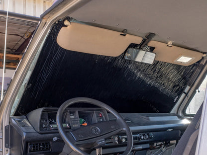 GoWesty Vanagon window cover insulation and privacy shade installed on van window, providing insulation and privacy.