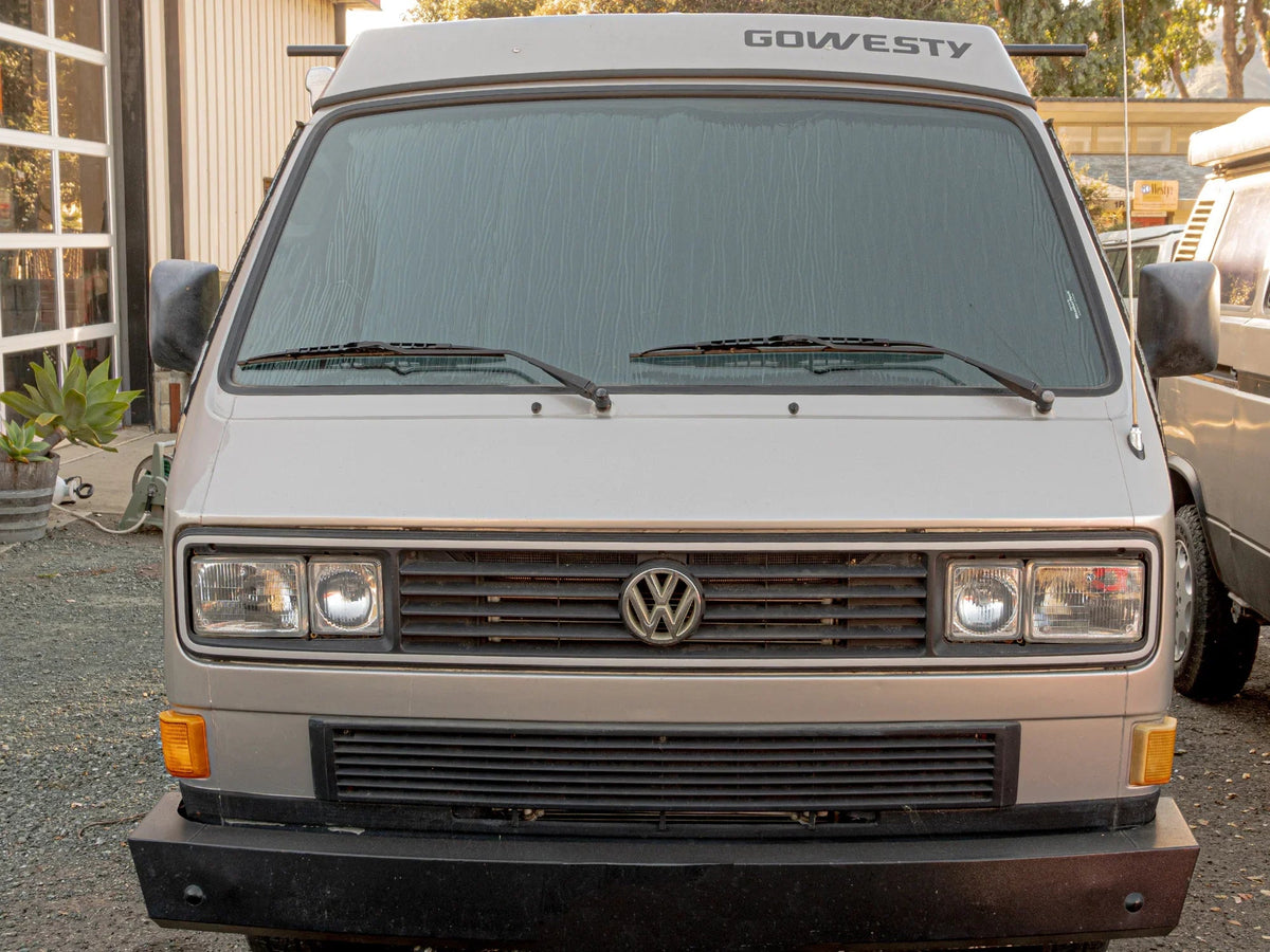 Black insulation and privacy shade for Vanagon window cover by GoWesty, designed to block light and improve privacy.