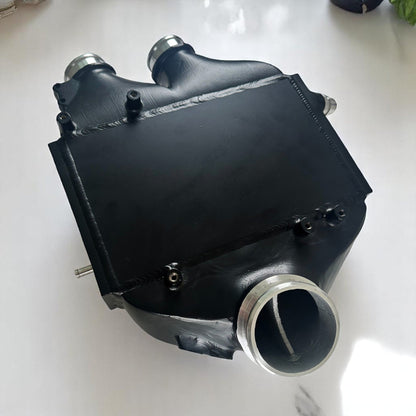 Palenon Performance top mount S55 intercooler installed in a BMW F80 M3, F87 M2, or F82/F83 M4 engine bay.