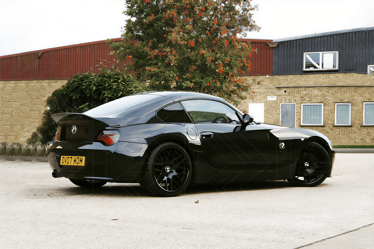 BMW Z4 E85/E86 black Hyper Duck Tail trunk spoiler V2 by K2 Industries, showing sleek aerodynamic design on the car.