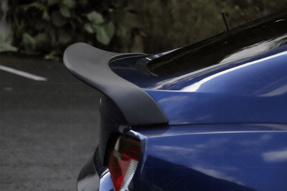 Black Hyper Duck Tail Trunk Spoiler for BMW Z4 E85/E86 by K2 Industries, showing the sleek spoiler on the car's trunk.