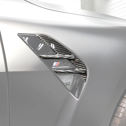 BMW 3/4 Series G80/G81/G82/G83 carbon fiber fender vents by K2 Industries, shown on the vehicle's front fenders.