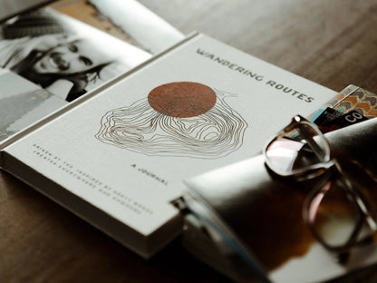 Open wandering routes journal by GoWesty featuring map illustrations for travel planning and journaling.