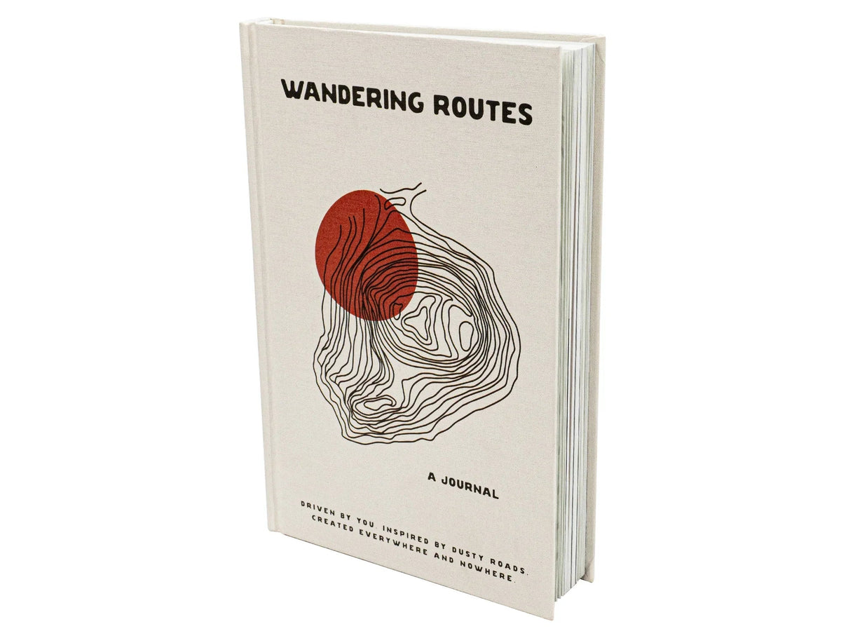 Open wandering routes journal by GoWesty featuring map illustrations and handwritten-style pages for travel planning and storytelling.