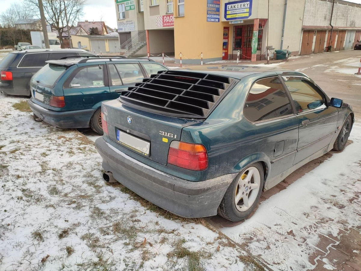 Black BMW E36 Compact Series 3 windshield louvers by K2 Industries, designed for 1992-1999 models, shown on the vehicle.