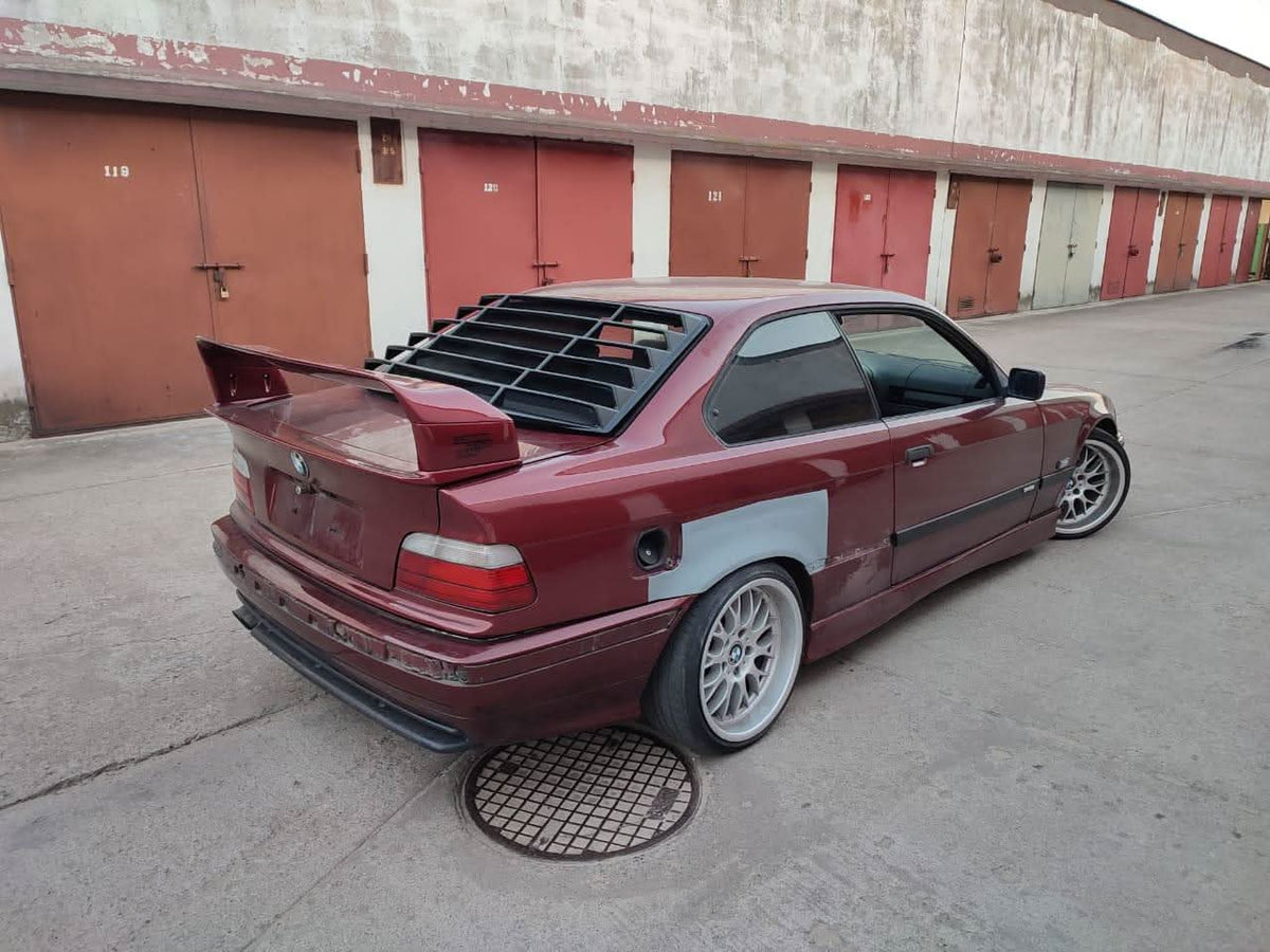 Black BMW E36 Coupe Series 3 windshield louvers by K2 Industries, sleek black design for 1992-1999 model.