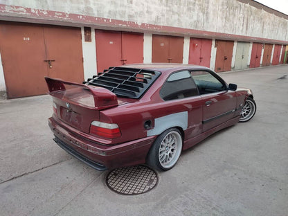 Black BMW E36 Coupe Series 3 windshield louvers by K2 Industries, sleek black design for 1992-1999 model.