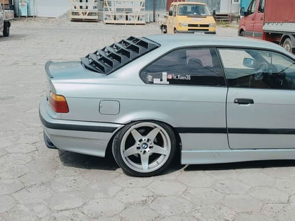 Black BMW E36 Coupe Series 3 windshield louvers by K2 Industries, designed for 1992-1999 models, shown on the car.