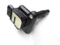 Genuine OEM ignition coil for Audi VW 1.8L and 4.2L engines, compatible with 1999-2004 models, shown in a car engine bay.