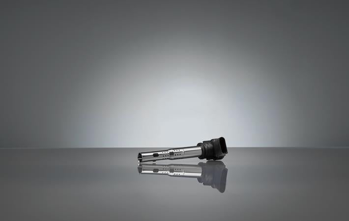 Genuine OEM ignition coil for Audi VW 4.0L engine, compatible with 2013-2018 models, shows the black coil with connector.