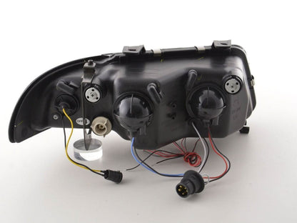 Audi A4 B5 8D black angel eye headlights set by K2 Industries, 1995-1999, showing sleek black headlight design with angel eye rings.