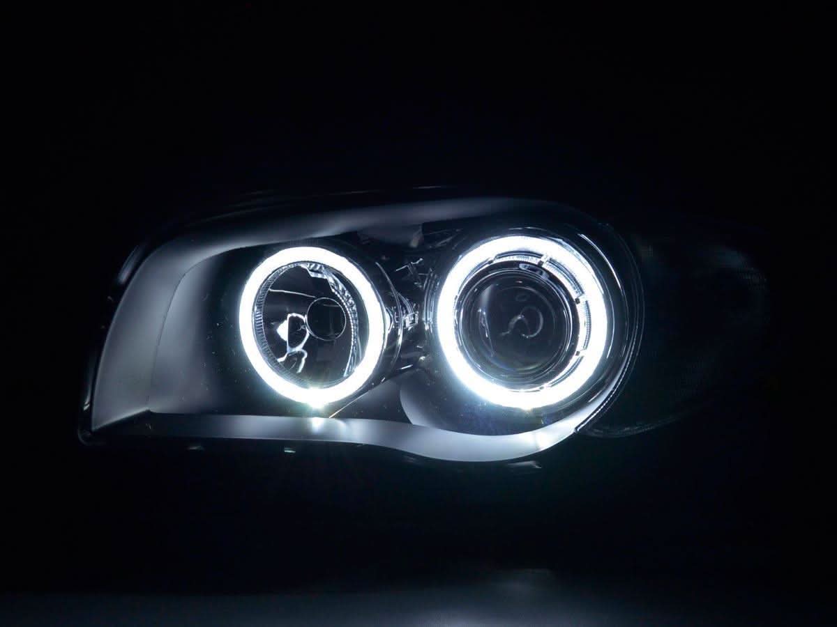 BMW 1-Series E81/E82/E87/E88 LED headlights with angel eyes by K2 Industries, showing the front view with illuminated rings.