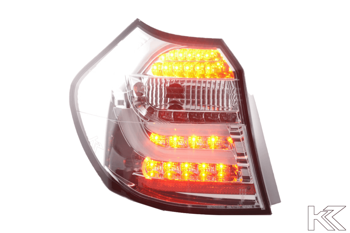 BMW 1 Series E87 E81 chrome LED tail lights for 2004-2007, 3/5-door hatchback, by K2 Industries, with sleek red and clear lenses.