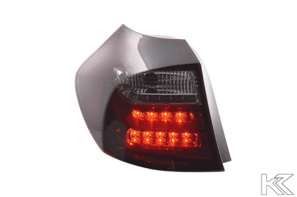 BMW 1 Series E87/E81 3/5-door red smoked LED tail lights by K2 Industries, for models 2004-2007, showing sleek taillight design