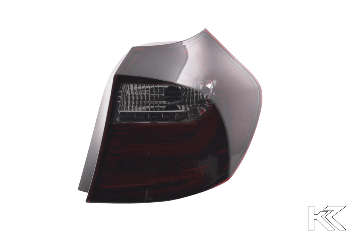 BMW 1 Series E87/E81 3/5-door red smoked LED tail lights by K2 Industries, for models 2004-2007, showcasing sleek design and lighting.