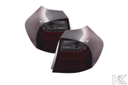 BMW 1 Series E87/E81 3/5-door red smoked LED tail lights by K2 Industries, showing sleek automotive lighting for 2007-2011.