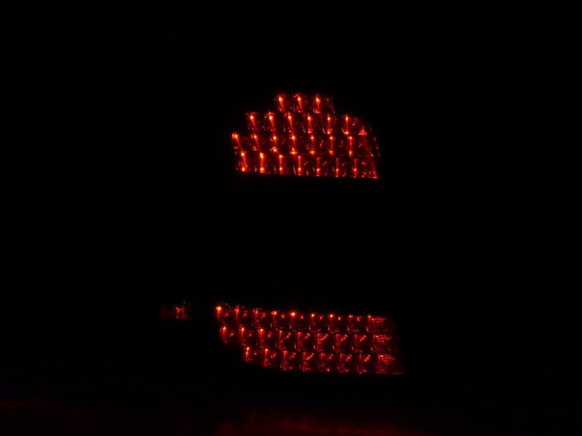 BMW 1 Series E87 black LED tail lights by K2 Industries for 2004-2007, showing close-up of sleek taillight design.