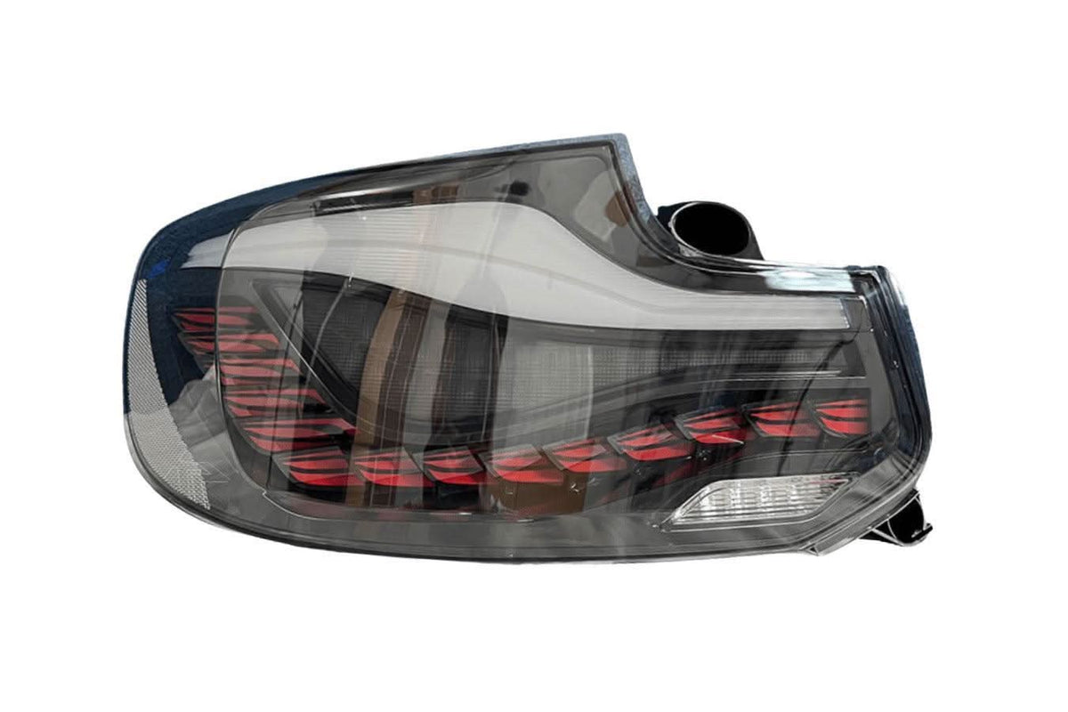 BMW 2 Series and M2 GTS style OLED tail lights by K2 Industries, showing sleek, illuminated LED tail light assembly on a 2014-2021 model.