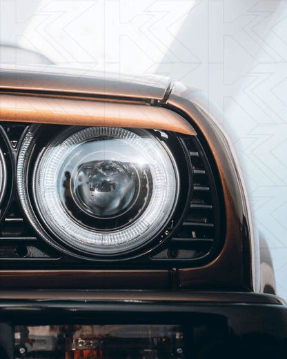 BMW 3-series E30 2/4 door black Angel Eyes headlights set by K2 Industries, for models 1987-1991 with sleek headlight design.