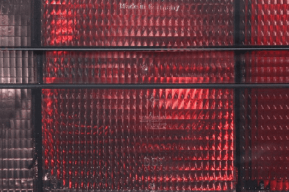 BMW 3 Series E30 original Startec taillights by K2 Industries, 1984-1991, showing red and clear lens with mounting brackets.