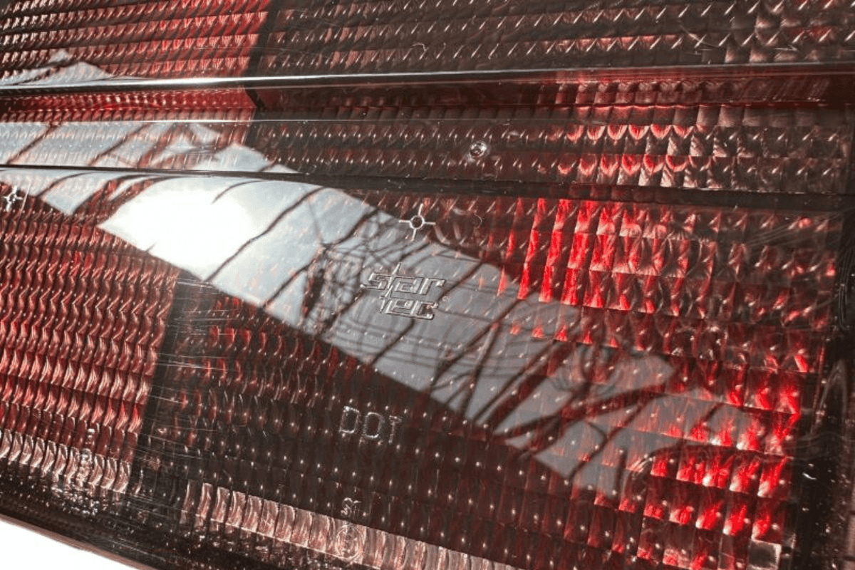 BMW 3 Series E30 original Startec taillights by K2 Industries, rear view showing red and clear lens design for 1984-1991.