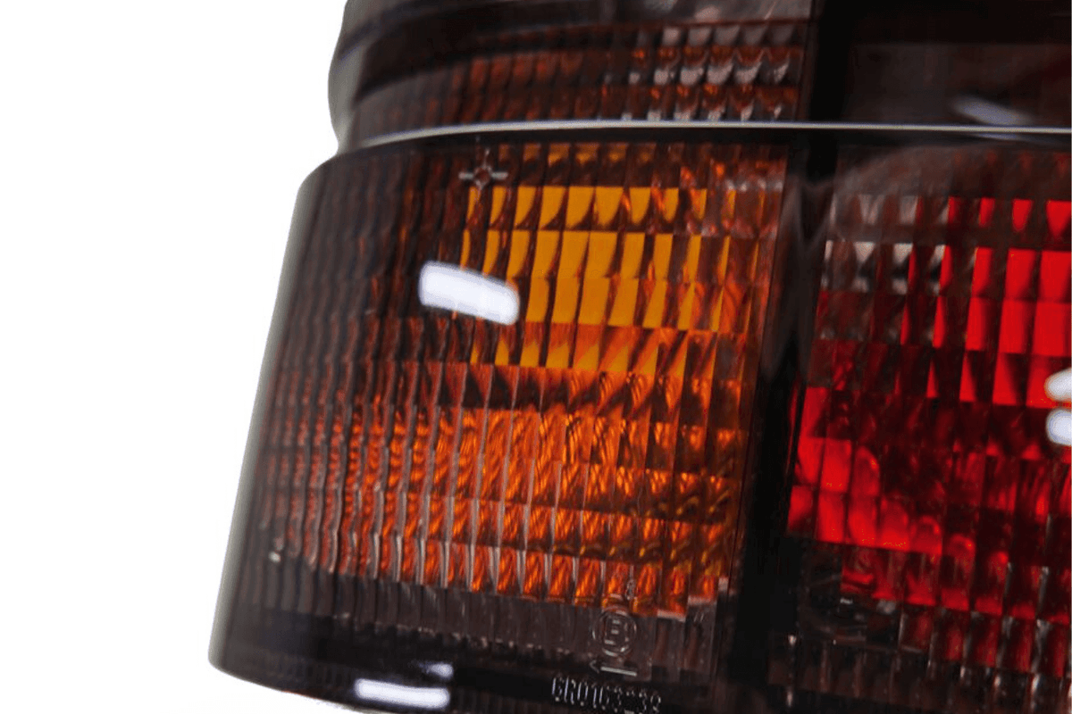 BMW 3 Series E30 original Startec tail lights by K2 Industries, 1984-1991, showing the red and clear lens design for rear lighting.