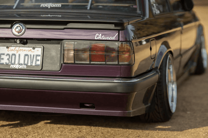 BMW 3 Series E30 K2 Industries original Startec taillights, 1984-1991, showing clear lens and red and amber sections for rear illumination.