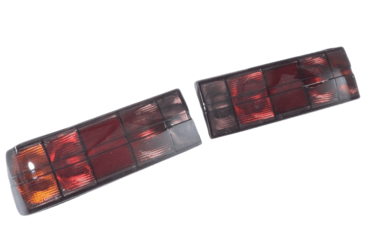BMW 3 Series E30 original Startec taillights by K2 Industries, rear view showing red and amber lens details for 1984-1991 models.