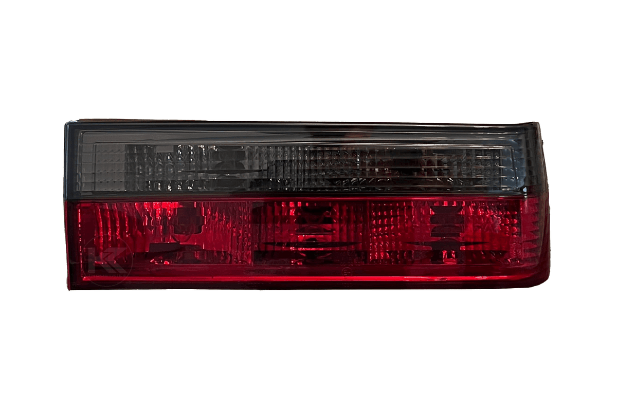 BMW 3-Series E30 pre-facelift tail lights in red smoked finish by K2 Industries, rear view showing sleek design for model years 1982-1987.