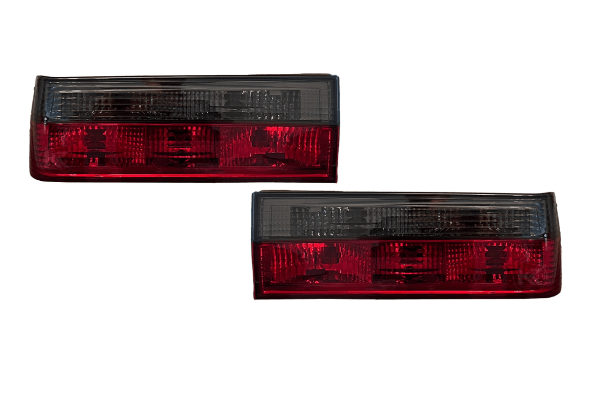 BMW 3-Series E30 pre-facelift red smoked tail lights by K2 Industries, showing close-up of sleek, smoked lens design.