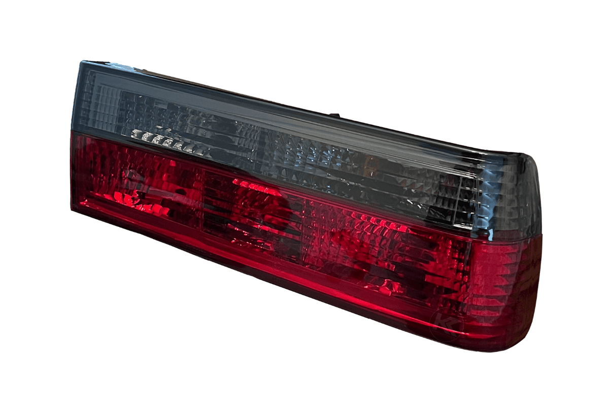 BMW 3-Series E30 pre-facelift tail lights in red smoked finish by K2 Industries, designed for 1982-1987 models.